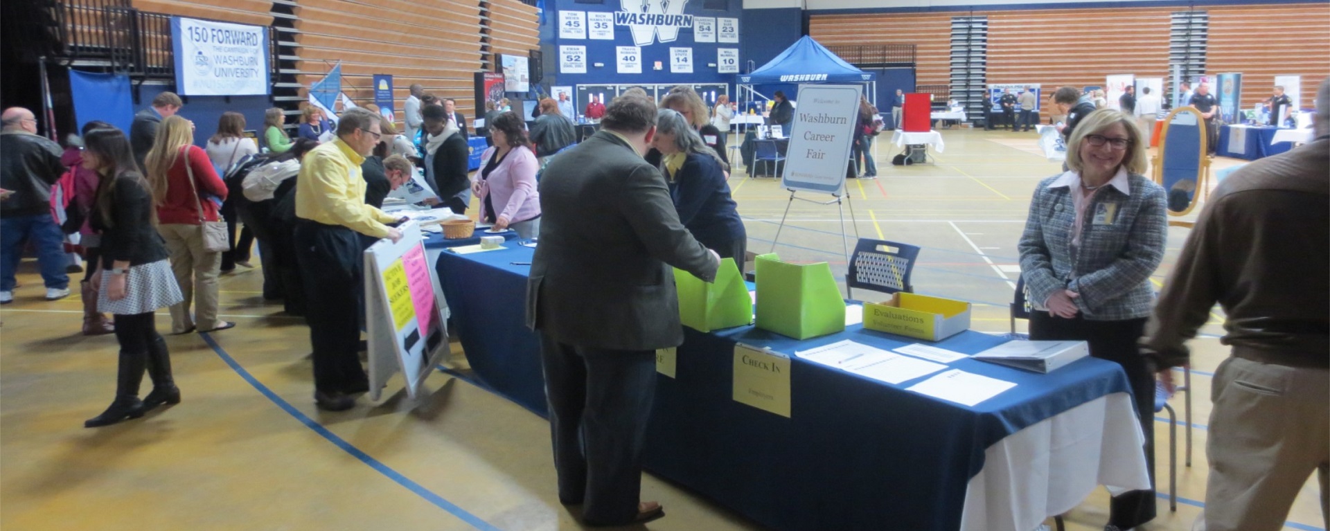 Students interacting with employers at career fair